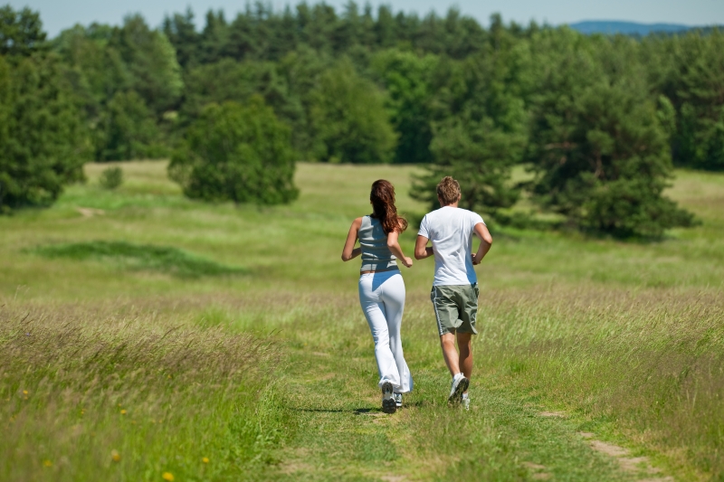 young-couple-jogging-outdoors-in-spring-nature